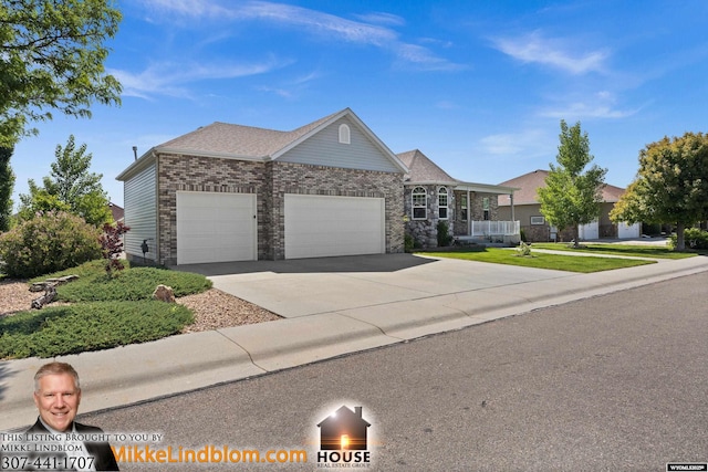 1513 Luker Dr, Casper, WY 82609 - ranch-style house with an attached garage, concrete driveway, brick siding, and a front yard