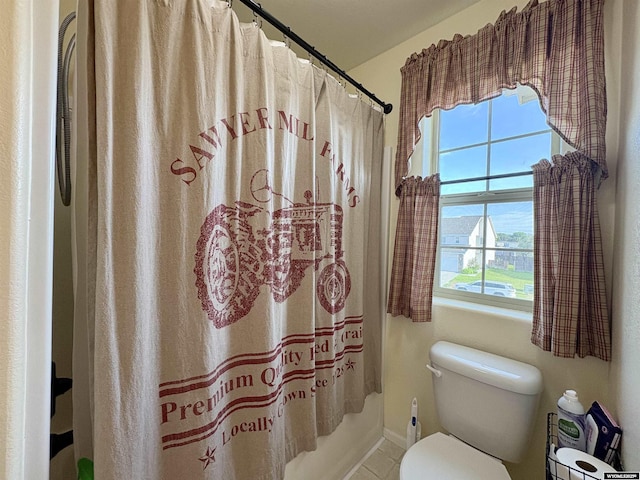 1261 Meadow Ln, Douglas, WY 82633 - bathroom with healthy amount of natural light, a shower with shower curtain, and tile patterned floors