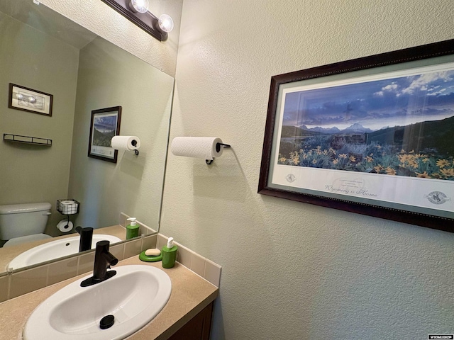 1261 Meadow Ln, Douglas, WY 82633 - half bath with vanity and a textured wall