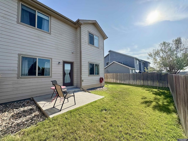 1261 Meadow Ln, Douglas, WY 82633 - rear view of property featuring a fenced backyard and a patio area