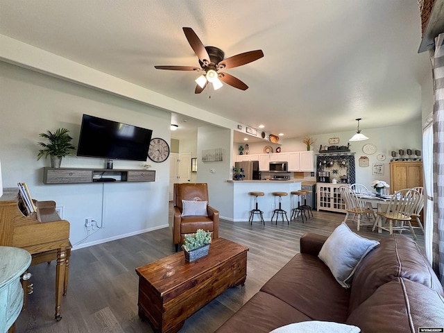 1261 Meadow Ln, Douglas, WY 82633 - living room with a ceiling fan and dark wood-style floors