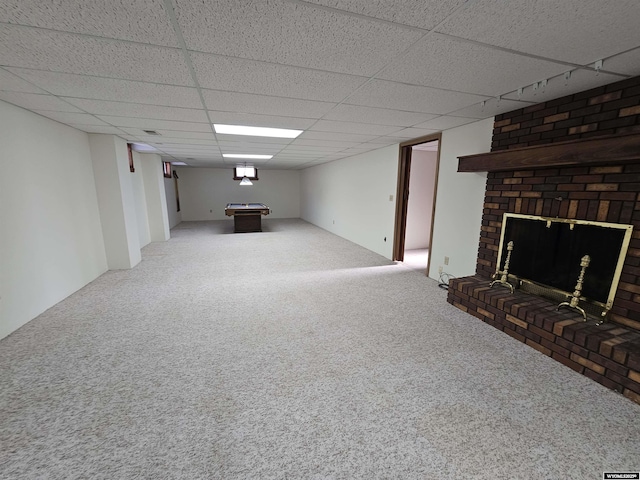 918 E 27th Ave, Torrington, WY 82240 - finished basement featuring carpet flooring, billiards table, a paneled ceiling, and a fireplace