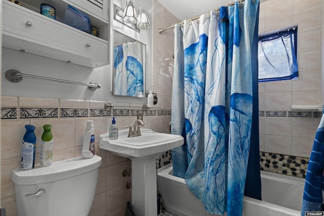 1831 Glendale Ave, Casper, WY 82601 - bathroom featuring shower / bathtub combination with curtain and tile walls