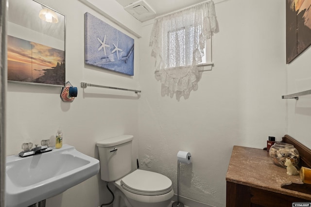 1831 Glendale Ave, Casper, WY 82601 - bathroom featuring a sink and toilet