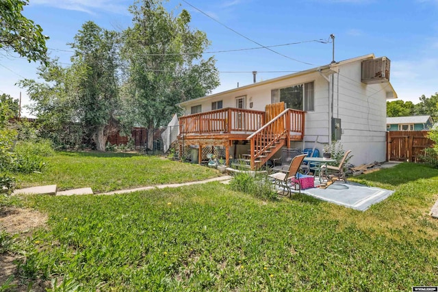 1831 Glendale Ave, Casper, WY 82601 - rear view of house featuring stairs, a fenced backyard, a deck, and a patio
