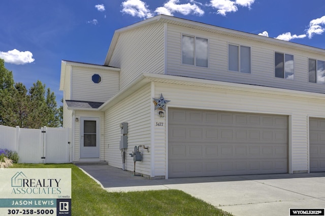 3477 Trappers Trl, Casper, WY 82604 - traditional-style home with an attached garage and a gate