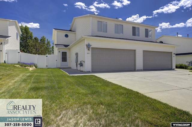 3477 Trappers Trl, Casper, WY 82604 - traditional-style house featuring a gate, concrete driveway, and an attached garage