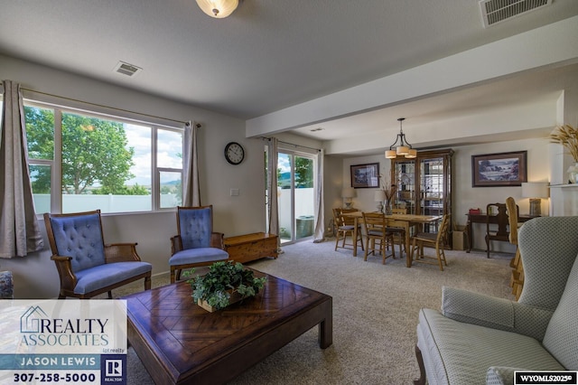 3477 Trappers Trl, Casper, WY 82604 - living area featuring carpet floors and a chandelier