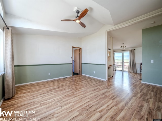 7459 Geary Dome Rd, Evansville, WY 82636 - spare room featuring lofted ceiling, ceiling fan, wood finished floors, and a smoke detector