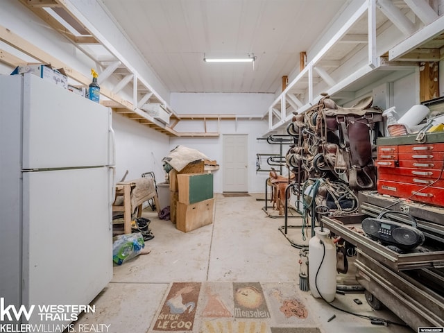7459 Geary Dome Rd, Evansville, WY 82636 - basement featuring freestanding refrigerator
