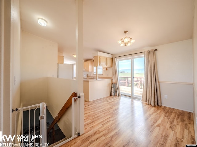 7459 Geary Dome Rd, Evansville, WY 82636 - living room with light wood-style flooring and a chandelier