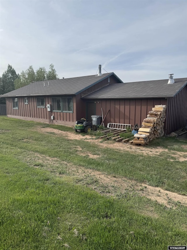 1512 Highview Dr, Dubois, WY 82513 - back of house featuring a lawn and board and batten siding