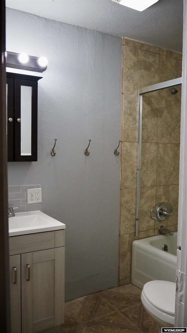 1041 S Mckinley St, Casper, WY 82601 - full bath with vanity, bathtub / shower combination, and tile patterned flooring