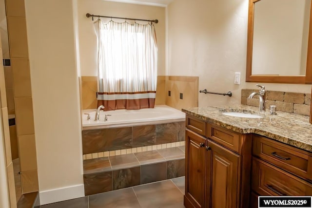 1011 Heritage Cove Dr, Lyman, WY 82937 - full bathroom with vanity, a bath, and tile patterned floors