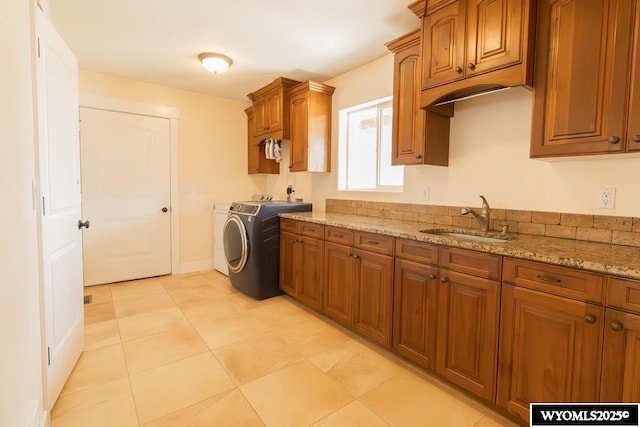1011 Heritage Cove Dr, Lyman, WY 82937 - laundry area with cabinet space and washing machine and clothes dryer