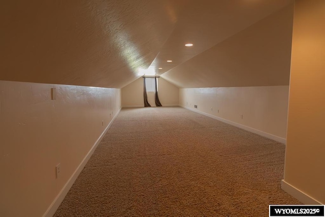 1011 Heritage Cove Dr, Lyman, WY 82937 - additional living space featuring carpet, vaulted ceiling, and recessed lighting