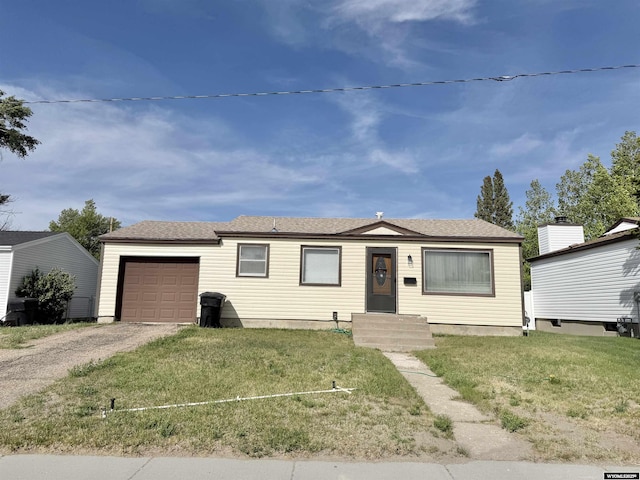 422 Beech Ave, Kemmerer, WY 83101 - ranch-style home with a garage, driveway, and a front yard