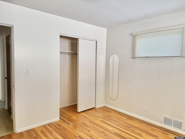 422 Beech Ave, Kemmerer, WY 83101 - unfurnished bedroom with light wood-style floors and a closet