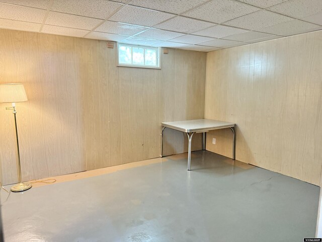 422 Beech Ave, Kemmerer, WY 83101 - below grade area featuring a paneled ceiling and wood walls