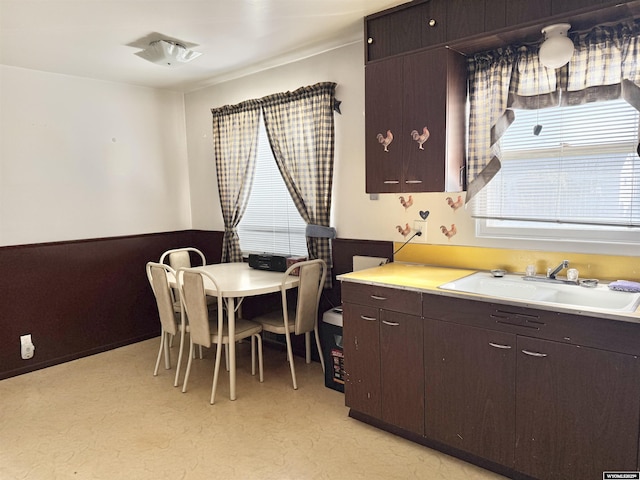 422 Beech Ave, Kemmerer, WY 83101 - kitchen with light countertops and dark brown cabinets