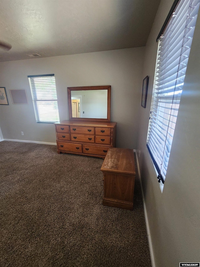 828 Fort St, Buffalo, WY 82834 - carpeted bedroom featuring baseboards
