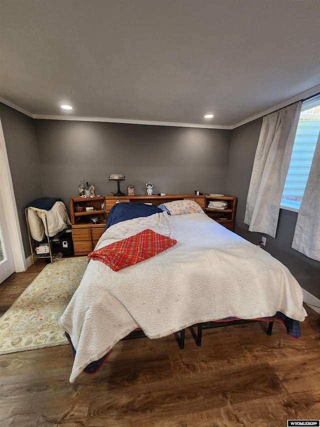 828 Fort St, Buffalo, WY 82834 - bedroom with crown molding, wood finished floors, and recessed lighting