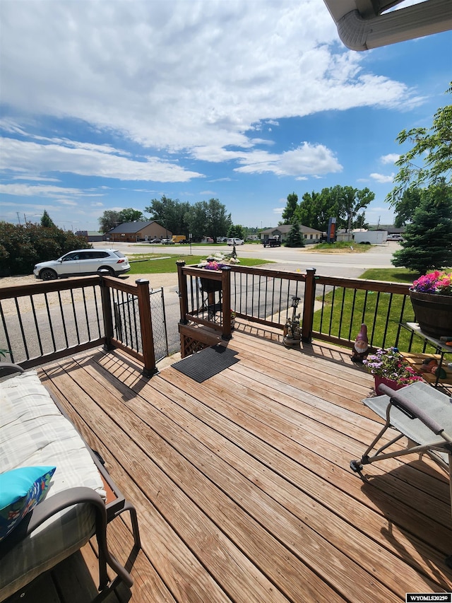 828 Fort St, Buffalo, WY 82834 - wooden porch featuring a lawn