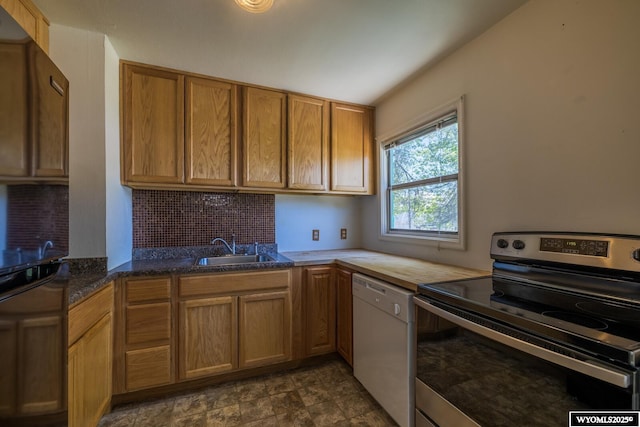 2841 E 4th St, Casper, WY 82609 - kitchen featuring stainless steel range with electric stovetop, white dishwasher, decorative backsplash, and brown cabinets