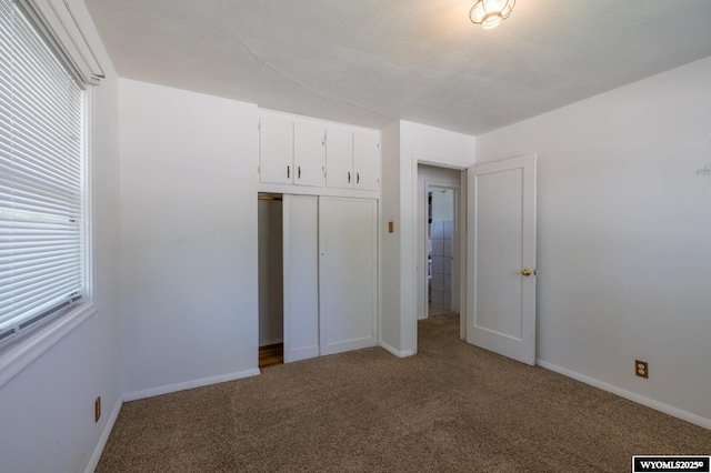 2841 E 4th St, Casper, WY 82609 - unfurnished bedroom featuring carpet flooring and a closet
