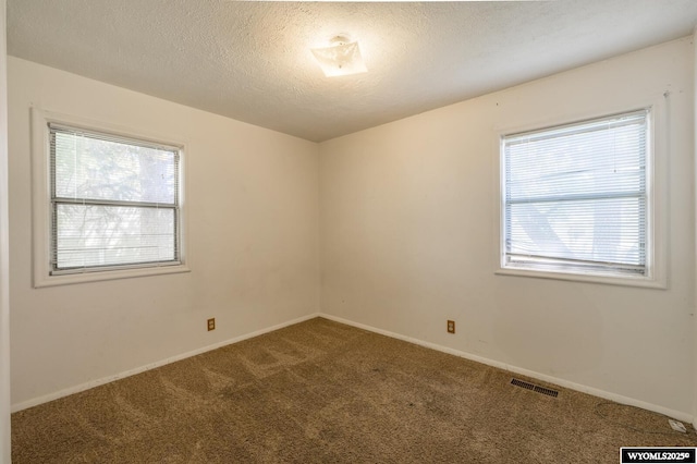 2841 E 4th St, Casper, WY 82609 - empty room with carpet and a textured ceiling
