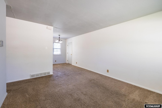 2841 E 4th St, Casper, WY 82609 - unfurnished room with a chandelier and carpet floors