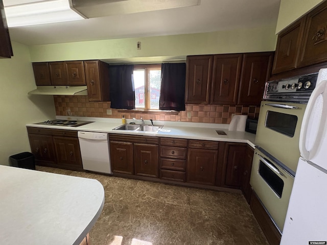 1501 N Federal Blvd, Riverton, WY 82501 - kitchen featuring white dishwasher, electric stovetop, decorative backsplash, multiple ovens, and light countertops