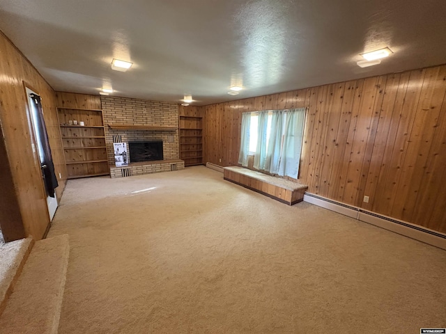 1501 N Federal Blvd, Riverton, WY 82501 - unfurnished living room featuring wooden walls, a brick fireplace, built in features, baseboard heating, and light colored carpet