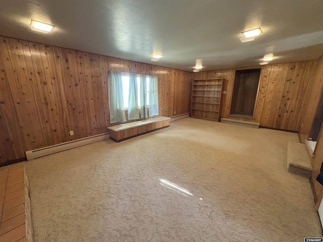 1501 N Federal Blvd, Riverton, WY 82501 - basement with wood walls, a baseboard heating unit, and light carpet