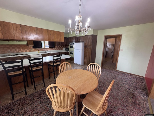 1501 N Federal Blvd, Riverton, WY 82501 - dining area featuring a chandelier