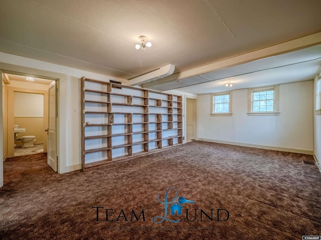 719 E 4th St, Casper, WY 82601 - below grade area with carpet flooring and baseboards