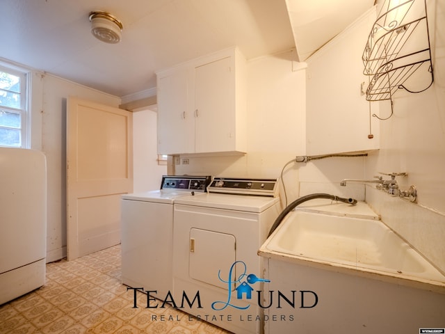 719 E 4th St, Casper, WY 82601 - washroom with cabinet space, light floors, and independent washer and dryer