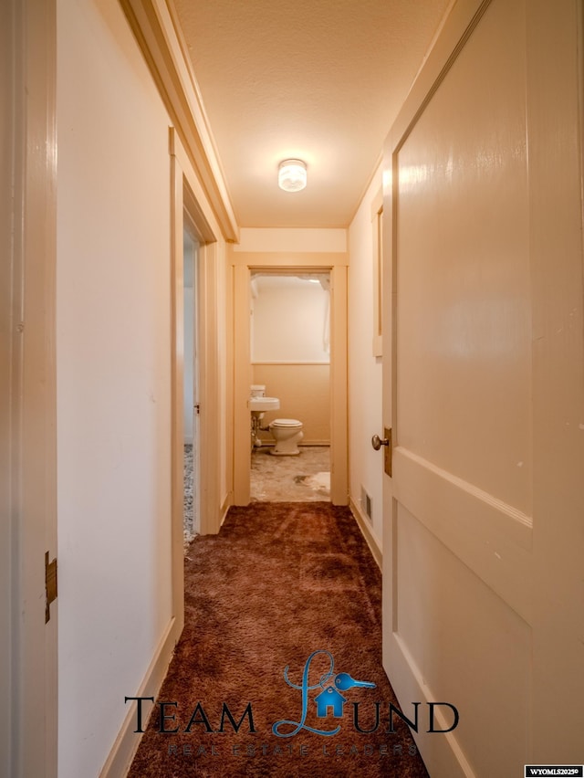 719 E 4th St, Casper, WY 82601 - hall featuring dark colored carpet