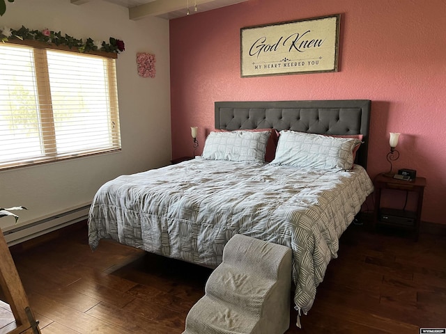 4359 Almy Rd Unit 107, Evanston, WY 82930 - bedroom with hardwood / wood-style flooring, a baseboard radiator, and beam ceiling
