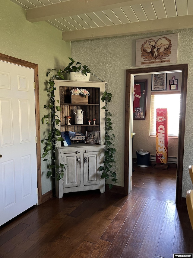 4359 Almy Rd Unit 107, Evanston, WY 82930 - bar with a textured wall, dark wood-style floors, and a wood ceiling with exposed beams