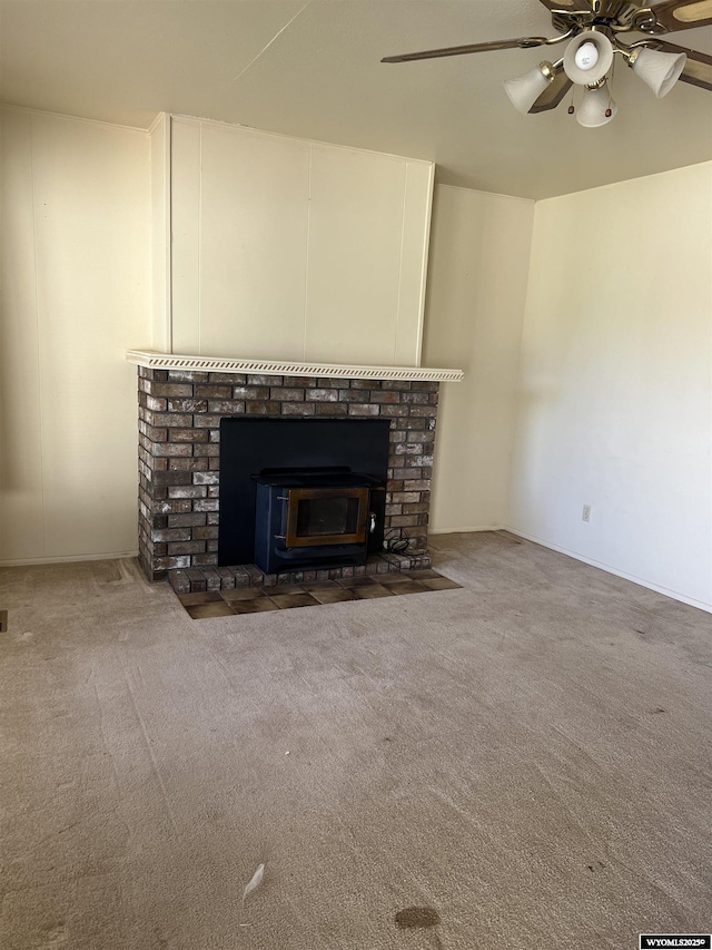 133 Shady Ln, Evanston, WY 82930 - detailed view of a ceiling fan, carpet floors, and a brick fireplace