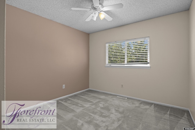 2240 E 17th St, Casper, WY 82609 - carpeted empty room with a textured ceiling and a ceiling fan