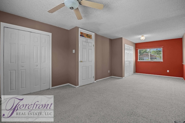 2240 E 17th St, Casper, WY 82609 - unfurnished bedroom featuring a textured ceiling, carpet, and ceiling fan