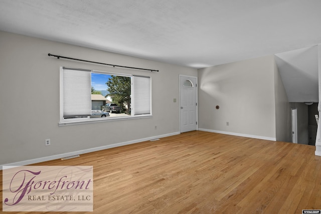 2240 E 17th St, Casper, WY 82609 - unfurnished living room featuring light wood finished floors
