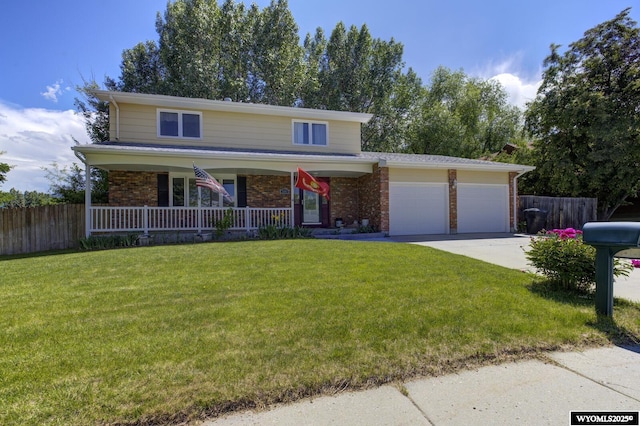 2203 W 42nd St, Casper, WY 82604 - traditional home with a porch, a garage, concrete driveway, and brick siding