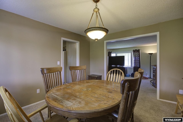 2203 W 42nd St, Casper, WY 82604 - carpeted dining area with baseboards
