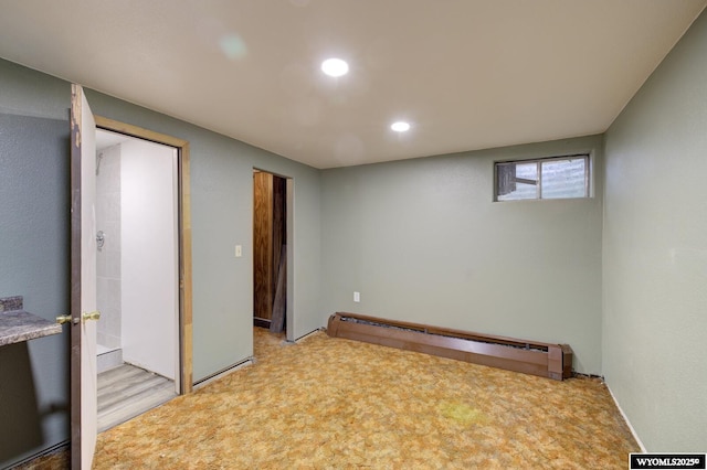 2203 W 42nd St, Casper, WY 82604 - basement featuring a baseboard radiator and recessed lighting
