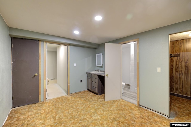 2203 W 42nd St, Casper, WY 82604 - unfurnished bedroom featuring light carpet, recessed lighting, and ensuite bathroom