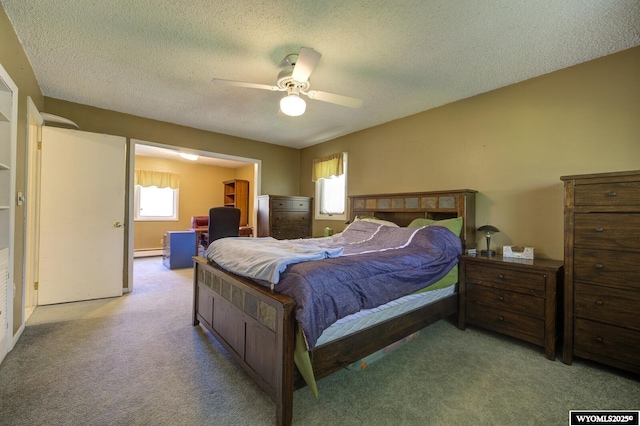 2203 W 42nd St, Casper, WY 82604 - bedroom with multiple windows, light carpet, a textured ceiling, a ceiling fan, and an office area