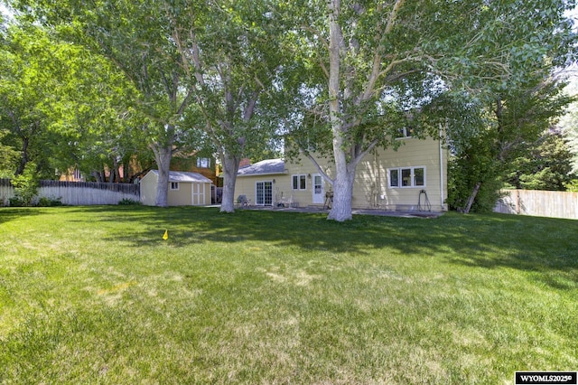 2203 W 42nd St, Casper, WY 82604 - fenced backyard with a storage shed
